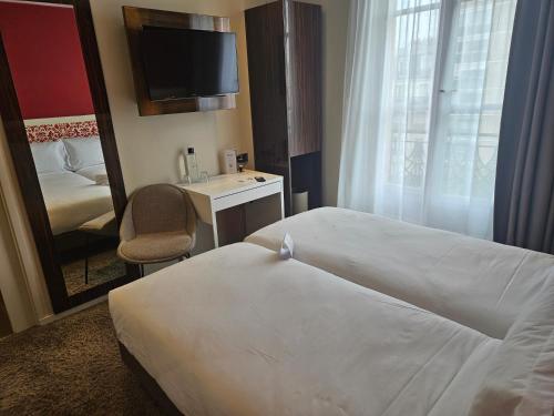 Imagen de la habitación del Hotel Pavillon Nation. Foto 16