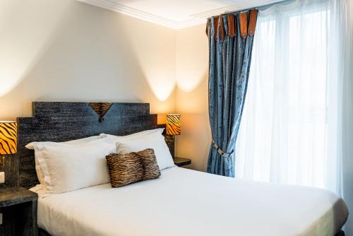 Imagen de la habitación del Hotel Pavillon Opera Grands Boulevards. Foto 15