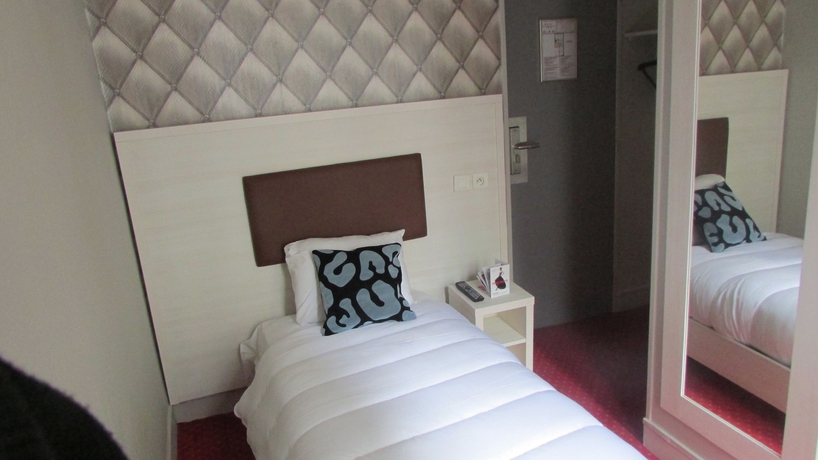 Imagen de la habitación del Hotel Pavillon Opera Lafayette. Foto 6