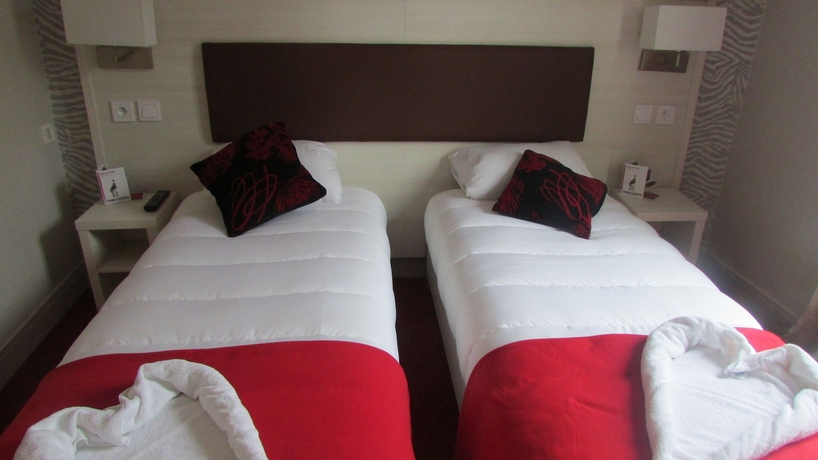 Imagen de la habitación del Hotel Pavillon Opera Lafayette. Foto 8