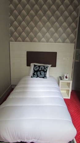 Imagen de la habitación del Hotel Pavillon Opera Lafayette. Foto 13