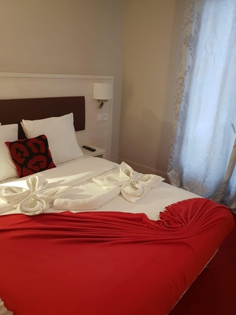 Imagen de la habitación del Hotel Pavillon Opera Lafayette. Foto 17