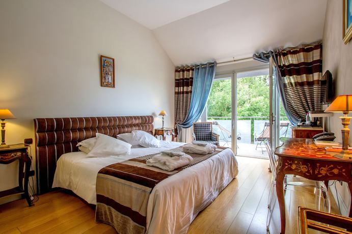 Imagen de la habitación del Hotel Pavillon du Chateau. Foto 16