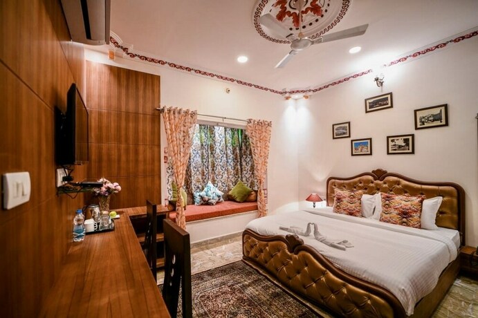 Imagen de la habitación del Hotel Pax Rafahiya Haveli Udaipur. Foto 20