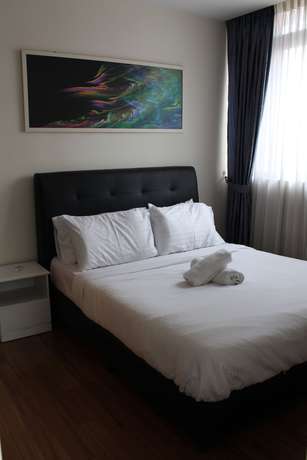 Imagen de la habitación del Hotel Peaceful Service Suites at Taragon Puteri Bintang. Foto 17