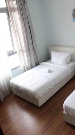 Imagen de la habitación del Hotel Peaceful Service Suites at Taragon Puteri Bintang. Foto 20