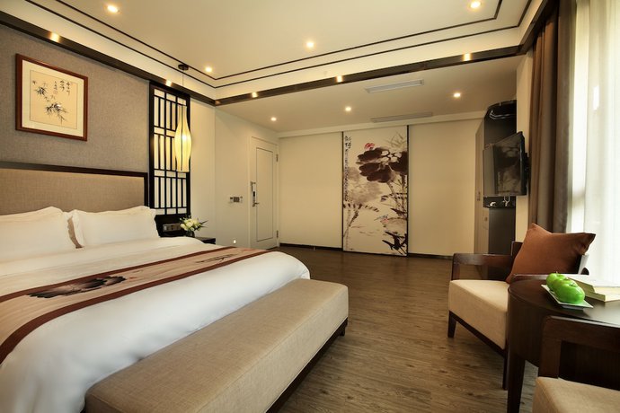 Imagen de la habitación del Hotel Peach Blossom Resort, GUILIN. Foto 8