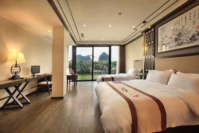 Imagen de la habitación del Hotel Peach Blossom Resort, GUILIN. Foto 9