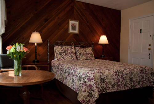 Imagen de la habitación del Hotel Peach Tree Inn and Suites. Foto 7