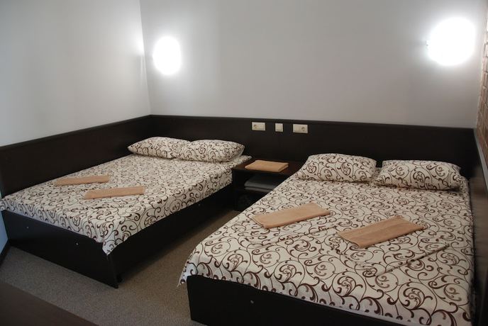 Imagen de la habitación del Hotel Peak Season. Foto 12