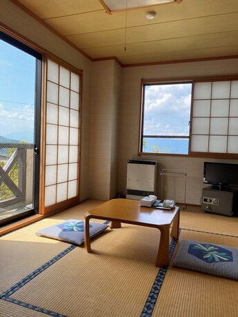 Imagen de la habitación del Hotel Peanuts House Kumakuma. Foto 11