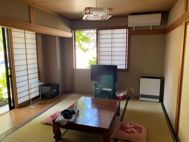 Imagen de la habitación del Hotel Peanuts House Kumakuma. Foto 13