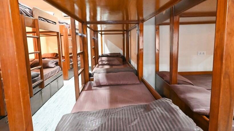 Imagen de la habitación del Hotel Pearl Courtyard Dormitory. Foto 9