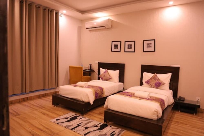 Imagen de la habitación del Hotel Pearl Pavilion Nr Medanta By OTABoostup. Foto 6