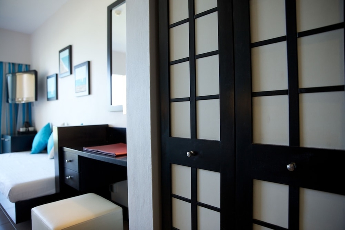 Imagen de la habitación del Hotel Pearle Beach Resort and Spa. Foto 10