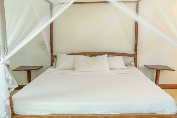 Imagen de la habitación del Hotel Pearls and Corals Resort. Foto 11