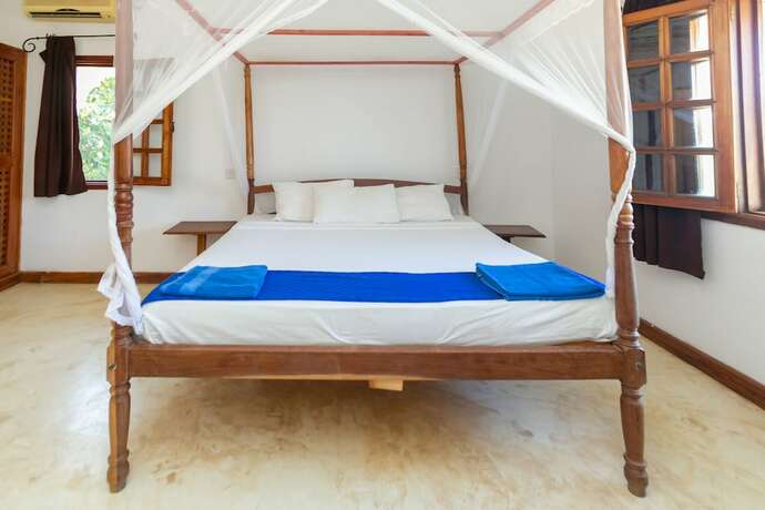 Imagen de la habitación del Hotel Pearls and Corals Resort. Foto 12