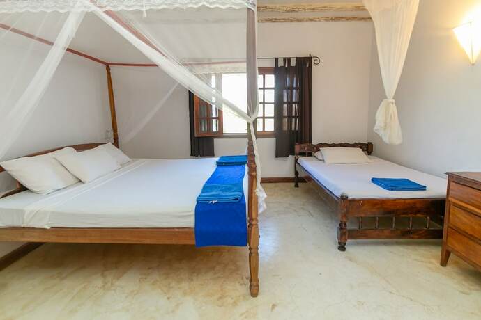 Imagen de la habitación del Hotel Pearls and Corals Resort. Foto 13