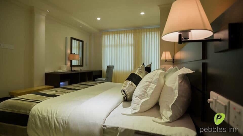 Imagen de la habitación del Hotel Pebbles Inn. Foto 8