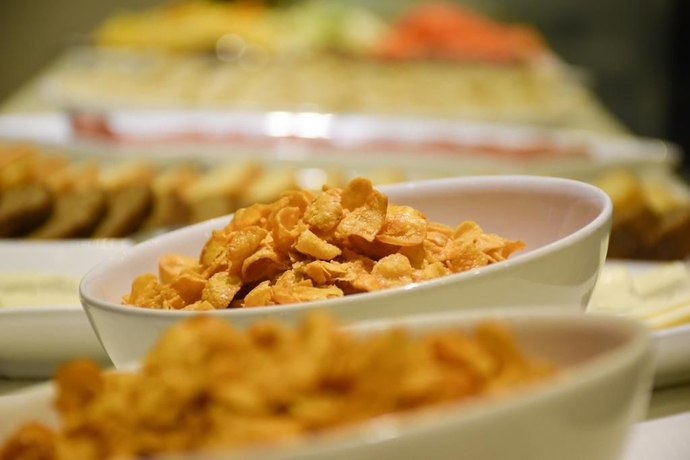 Imagen del bar/restaurante del Hotel Pebbles Inn. Foto 7