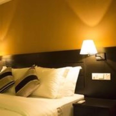 Imagen de la habitación del Hotel Pebbles Inn. Foto 11