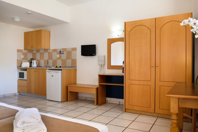 Imagen de la habitación del Hotel Pefkos Village Resort. Foto 13