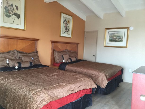 Imagen de la habitación del Hotel Pelican Inn and Suites. Foto 4