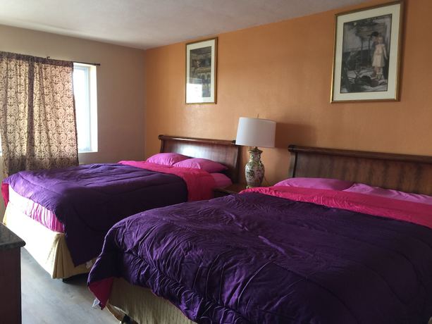 Imagen de la habitación del Hotel Pelican Inn and Suites. Foto 17