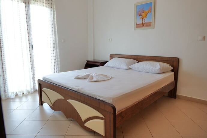 Imagen de la habitación del Hotel Pellumb Apartments. Foto 17