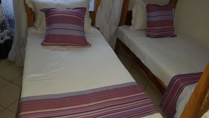 Imagen de la habitación del Hotel Pendo Villas Diani. Foto 18
