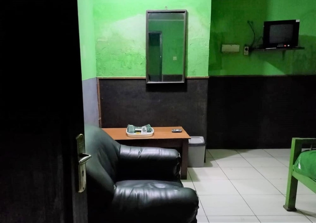 Imagen de la habitación del Hotel Penginapan 99. Foto 11