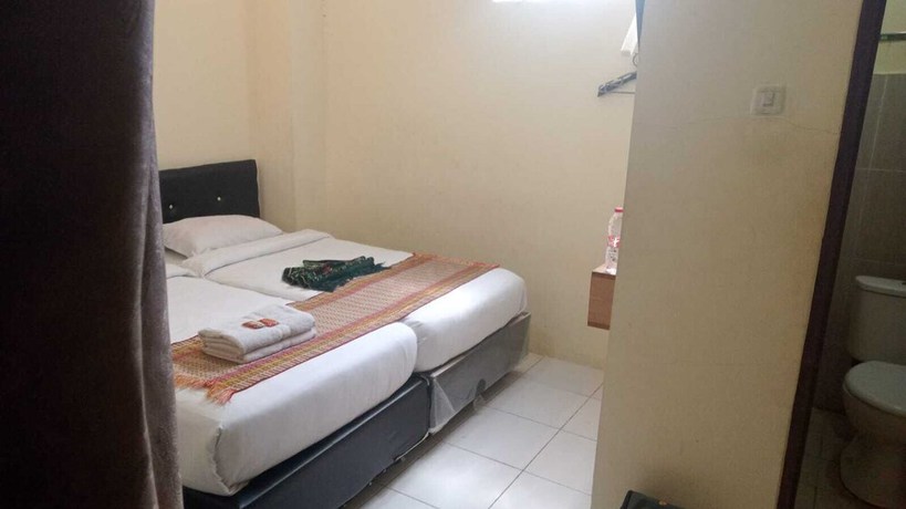 Imagen de la habitación del Hotel Penginapan Mutiara Syariah. Foto 11
