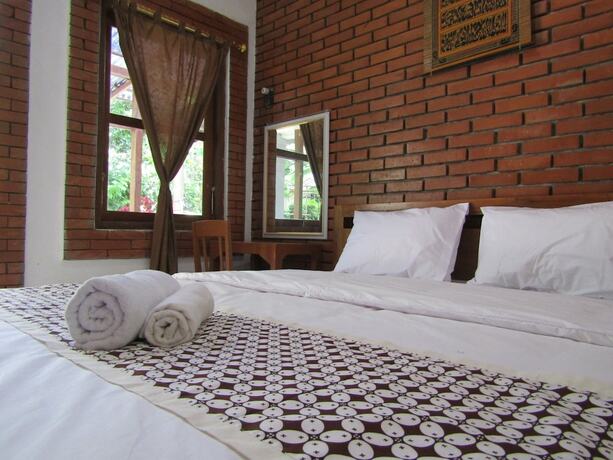 Imagen de la habitación del Hotel Penginapan Udin Syariah Bukit Rhema. Foto 19