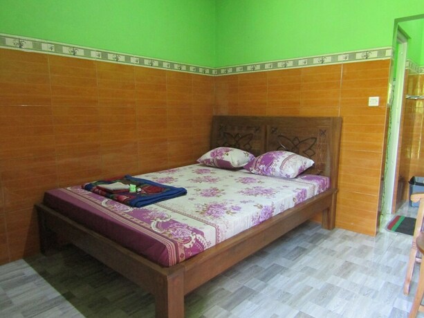 Imagen de la habitación del Hotel Penginapan Vionna. Foto 9