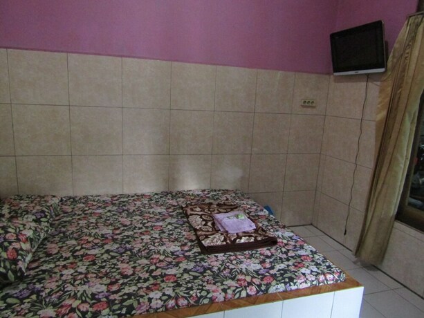 Imagen de la habitación del Hotel Penginapan Vionna. Foto 10