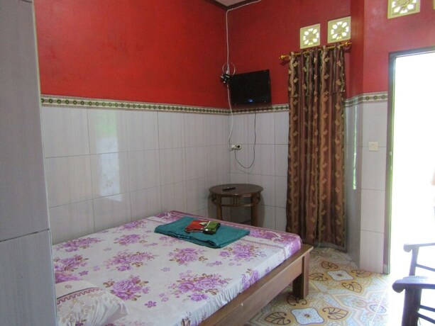 Imagen de la habitación del Hotel Penginapan Vionna. Foto 16