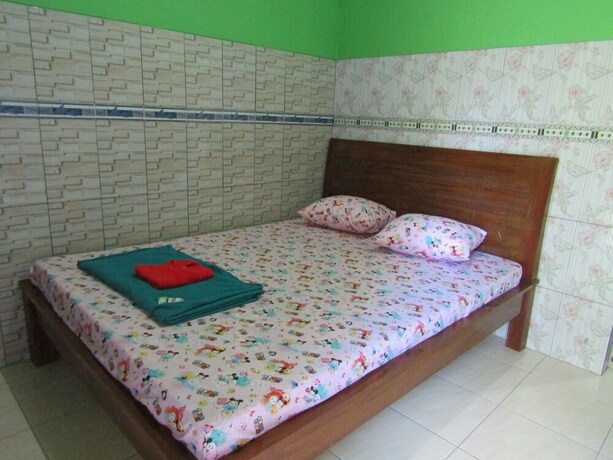 Imagen de la habitación del Hotel Penginapan Vionna. Foto 18