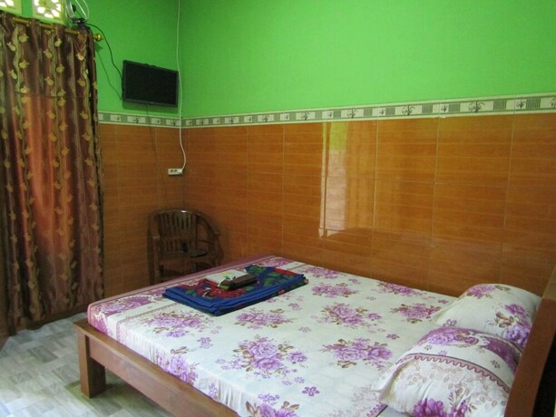 Imagen de la habitación del Hotel Penginapan Vionna. Foto 21