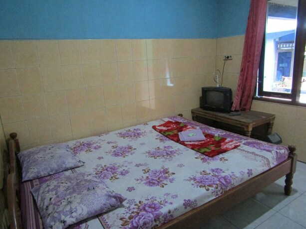 Imagen de la habitación del Hotel Penginapan Vionna. Foto 24