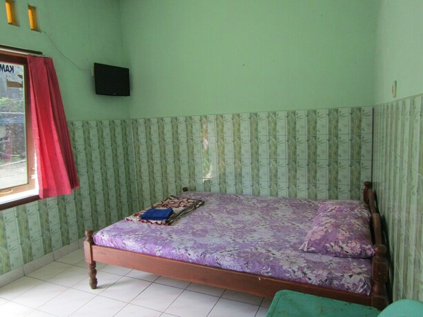 Imagen de la habitación del Hotel Penginapan Vionna. Foto 29