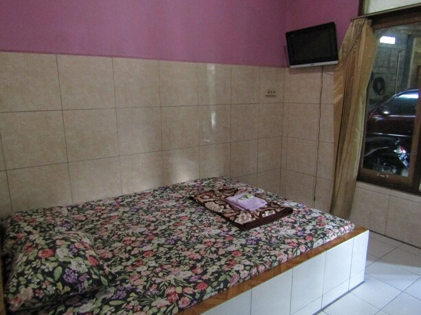 Imagen de la habitación del Hotel Penginapan Vionna. Foto 31