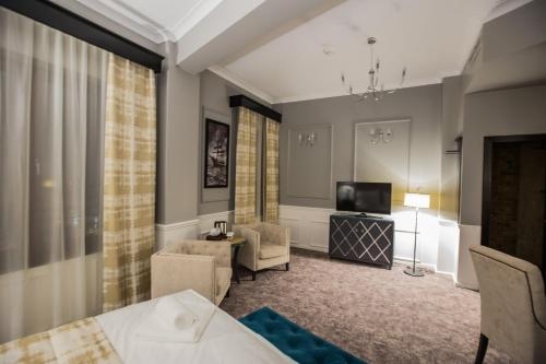 Imagen de la habitación del Hotel Peninsula Boutique. Foto 6