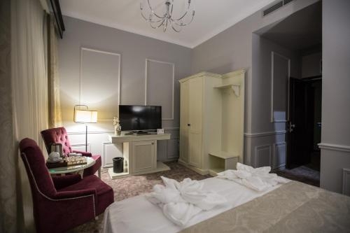 Imagen de la habitación del Hotel Peninsula Boutique. Foto 7