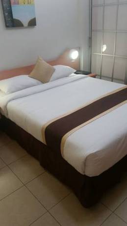 Imagen de la habitación del Hotel Peninsula International. Foto 11