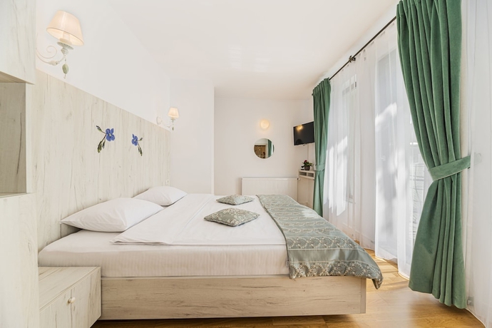 Imagen de la habitación del Hotel Pensiunea Hilltop. Foto 11