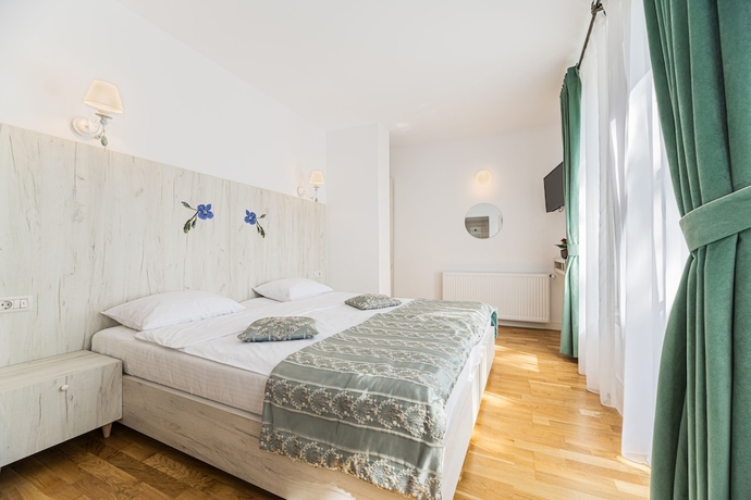 Imagen de la habitación del Hotel Pensiunea Hilltop. Foto 13