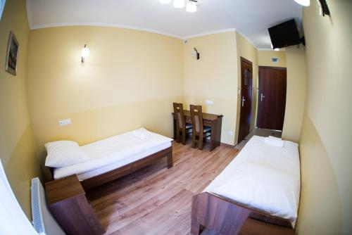 Imagen de la habitación del Hotel Pensjonat Pod Kogutami. Foto 7