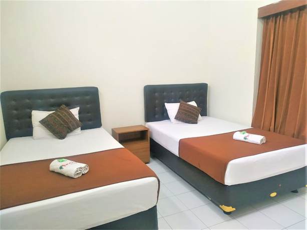 Imagen de la habitación del Hotel Perdana. Foto 10