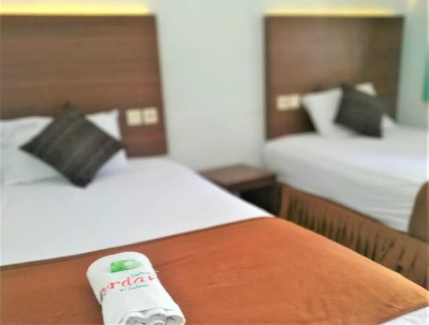 Imagen de la habitación del Hotel Perdana. Foto 13