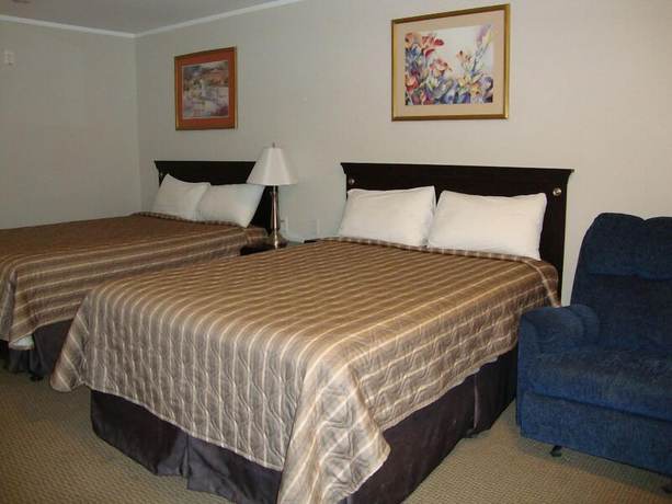 Imagen de la habitación del Hotel Perfect Inns And Suites. Foto 6